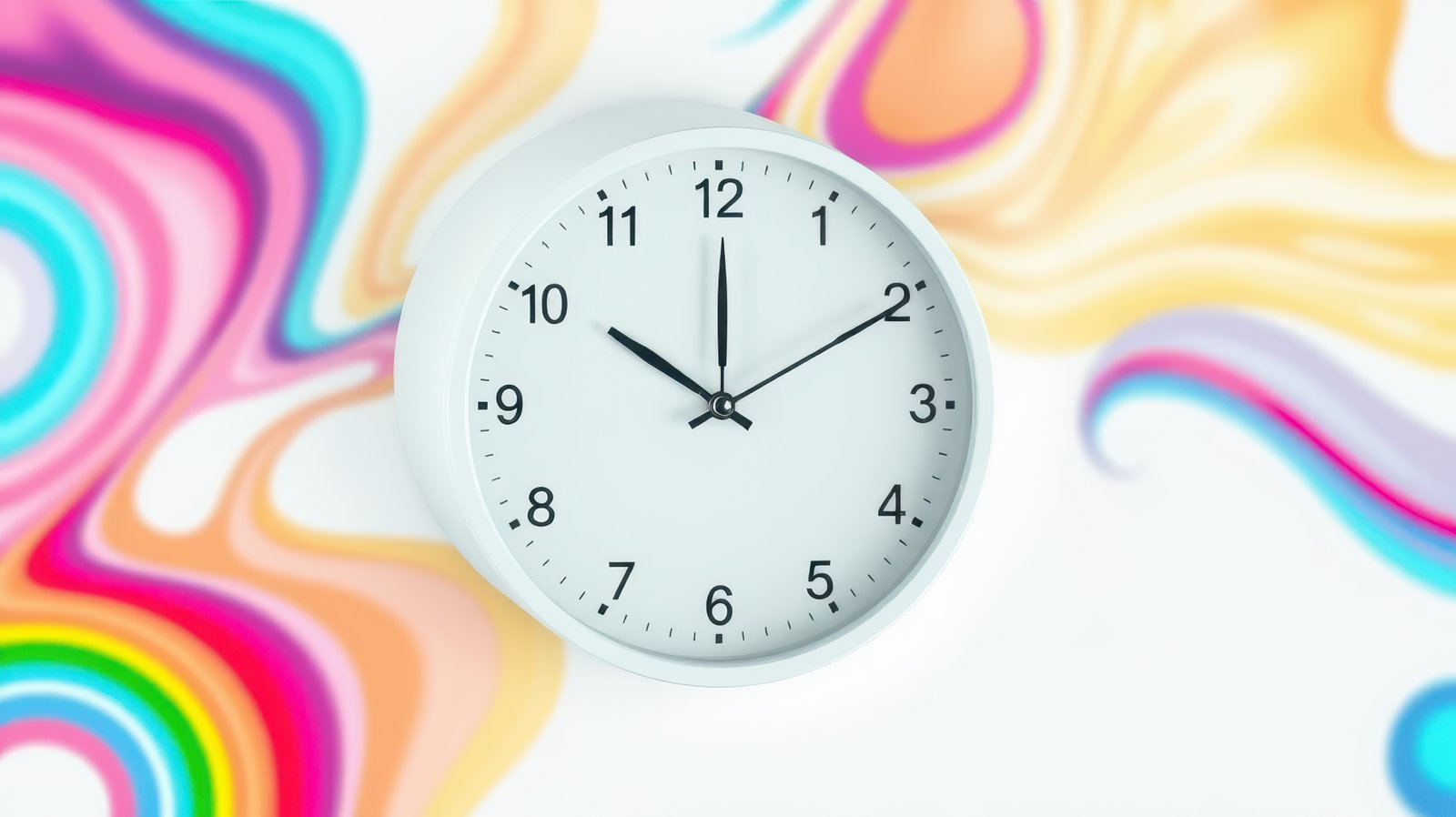 Wall clock displaying time on colorful abstract background during daylight in a bright interior